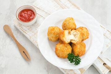 Delicious Bitterballen, typical Dutch snacks made from flour, cheese, milk coated with bread crumb filled with mozzarella.
