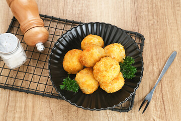 Delicious Bitterballen, typical Dutch snacks made from flour, cheese, milk coated with bread crumb filled with mozzarella.
