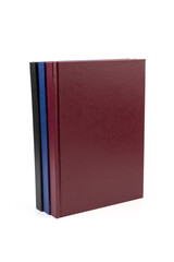 Stacked hardcover notebooks on white background. Education business concept.