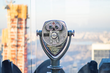 Coin operated binoculars looking out on New York City skyline