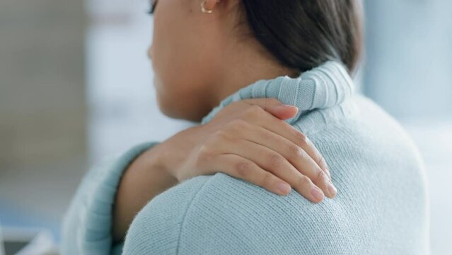 Massage, injury and pain with shoulder of woman with muscle, fatigue or accident. Physical therapy, health and stretching with young girl and backache from tired, stress or medical emergency