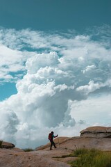 Rear View Of Man Standing On Field Against Sky - obrazy, fototapety, plakaty