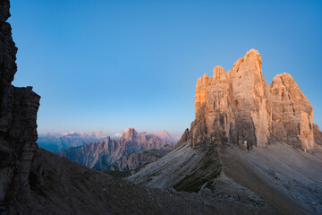 Fototapeta premium Stunning view of the Three Peaks of Lavaredo, (Tre cime di Lavaredo) during a beautiful sunrise. The Three Peaks of Lavaredo are the undisputed symbol of the Dolomites, Italy