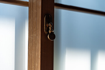 Old Japanese lock for sliding window in Japanese house.