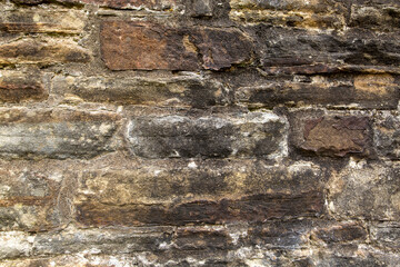 Stone wall of an ancient castle in England