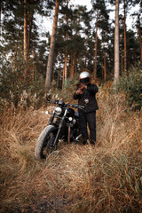 Fototapeta na wymiar Photo of a motorcyclist in the forest. 