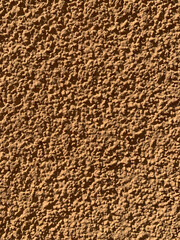 Background texture of brown plaster fur coat