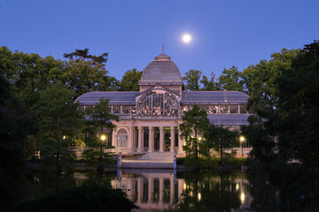 Fototapeta premium Night view of Crystal Palace in the Buen Retiro Park. Madrid, Spain. Palacio de cristal.