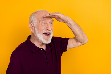 Profile side photo of excited senior man hand touch forehead look empty space isolated over yellow...