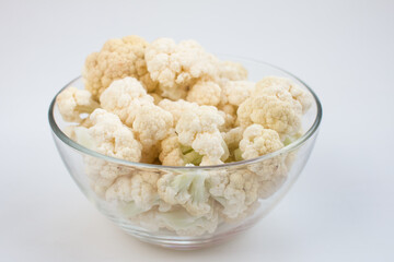 fresh cauliflower on a white background. A useful fortified vegetable for weight loss