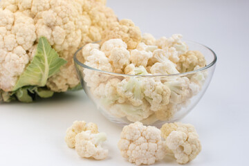 fresh cauliflower on a white background. A useful fortified vegetable for weight loss