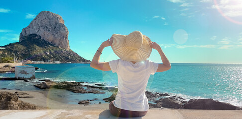 Rear view of woman tourist at Calpe - obrazy, fototapety, plakaty