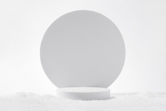 Cosmetic Background For Christmas And Winter Holiday. White Podium And Snow On A White Background.