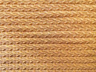 Texture of brown knitted jersey as a background. Banner for design