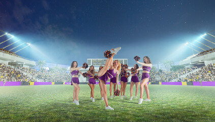 Group of cheerleaders in action on  stadium in night