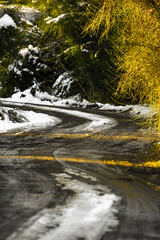 mountain road with snow and curves
