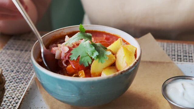 Hungarian goulash soup in the restaurant close up.
