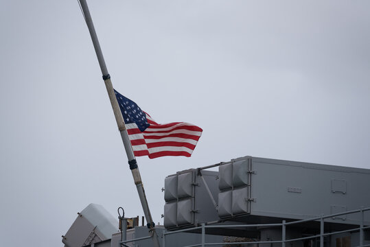 A FLAG ON A WARSHIP - American  amphibious assault ship on a visit to the port