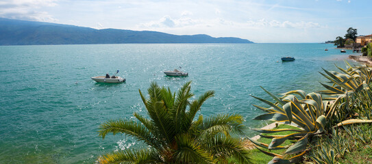 moored motorboats, lake Garda italy, tourist resort Gargnano