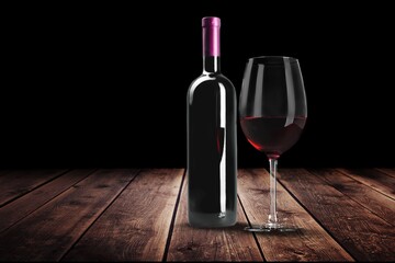 Bottle of tasty wine with a glass on the desk