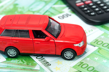 red car and money, euro and dollars. insurance concept