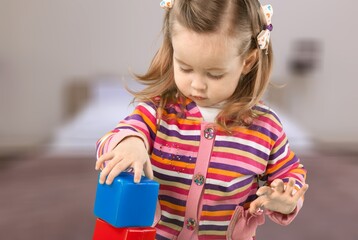 Child playing and studying alone at the room