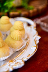 vanilla candy on a tray, candy store, condensed milk candy balls, condensed milk candy balls, candy balls