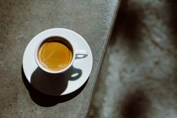 Cup of black coffee in a street cafe. Flat lay.