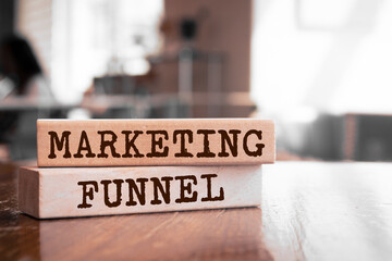 Wooden blocks with words 'marketing funnel'.