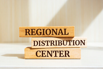Wooden blocks with words 'Regional Distribution Center'. Business concept