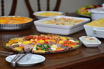 starter plate with cheese and fruit on the buffet, cold dish, cold platter,accompaniment to wine,...