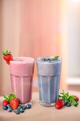 Glasses of berry smoothie or milkshake. Healthy breakfast drink
