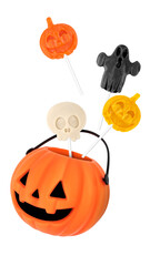 Halloween trick or treat bucket with lollipops float isolated on white background. Plastic...