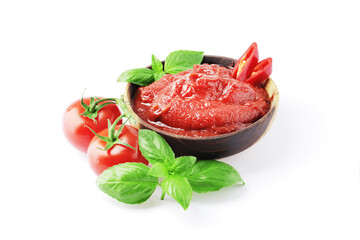 Tomato sauce in a bowl, Scented spice basil, Fresh ripe tomatoes, Chilli. Ingredient for the dish. Bowl full of tomato sauce with hot chili pepper, Spices and tomatoes isolated on white background.