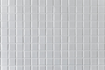 White mosaic background or texture in the bathroom.
