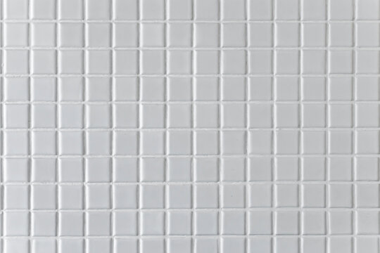 White mosaic background or texture in the bathroom.