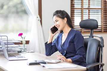 Obraz premium Busy business accountant Asian woman making call phone in home office and business working, Startup, report, tax, accounting, statistics, and analytic research concept