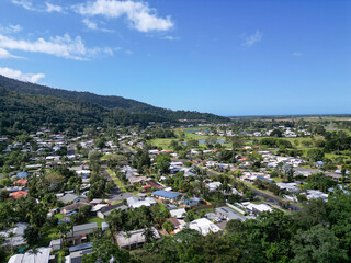 Fototapeta na wymiar Aerial photo of tropical housing estate in mountain range
