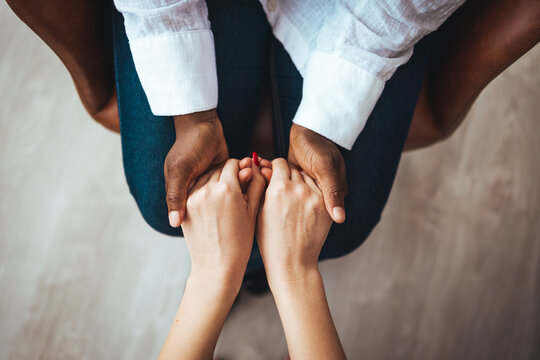 Hands of woman supporting her best friend. Two women talking about problems at home. Friendship consoling and care, unhappy girl support her girlfriend, copy space