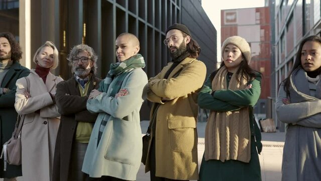 Successful diverse business team crossing arms outdoors. High quality 4k footage