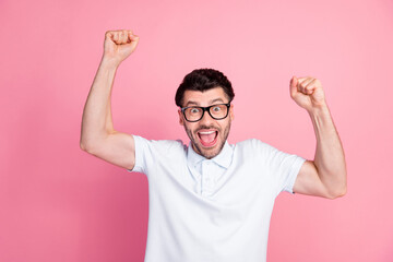 Portrait photo of young attractive handsome funny man toothy smile crazy open mouth fists up celebrate win his team manager isolated on bright pink color background