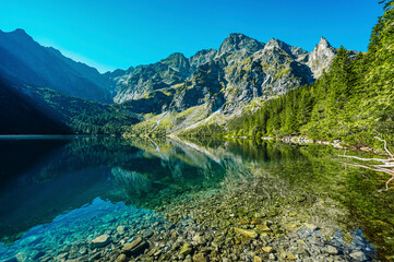 Naklejka na ściany i meble Tatra National Park in Poland. Famous mountains lake Morskie oko or sea eye lake In High Tatras. Five lakes valley