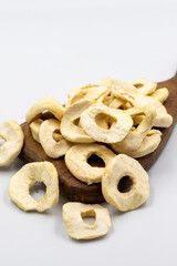 Dried apple slice isolated on white background. Dried fruit in sunlight. close up