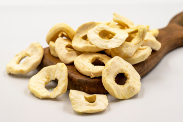 Dried apple slice isolated on white background. Dried fruit in sunlight. close up