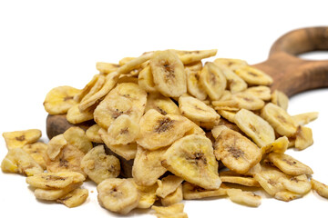Dried banana slice isolated on white background. Dried fruit in sunlight. close up