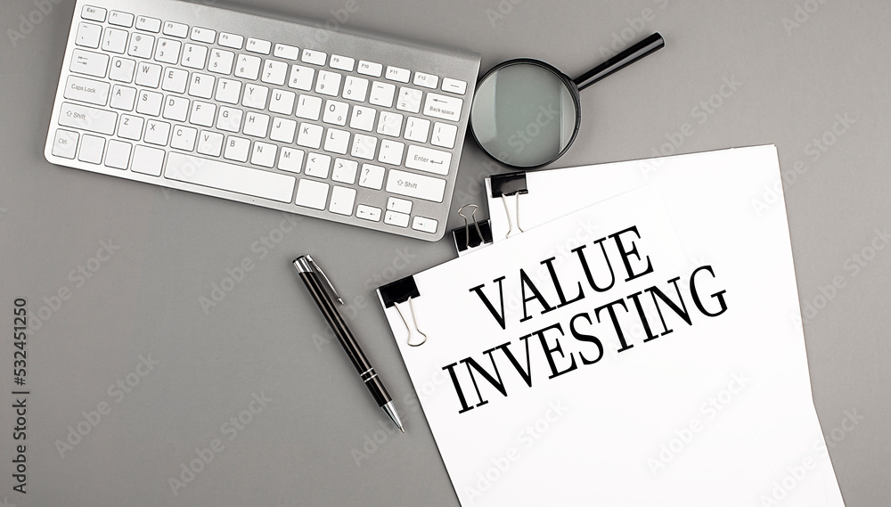 Poster value interesting text on paper with keyboard, magnifier and pen. business concept