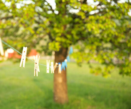 Outdoor Clothes Dryer With Wooden Clothespins Close Up