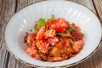 Yentafo red noodle stir fried sea food.