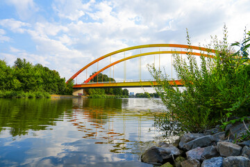 Bridge Dattelner Meerbogen near Datteln on the canal. Arched bridge in bright colors on the Dattelner Meer.
