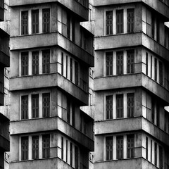 Dark and moody, dystopian, seamless soviet style concrete block houses. Black and white. Repeated, mosaic background tile. 3D illustration - 532455046